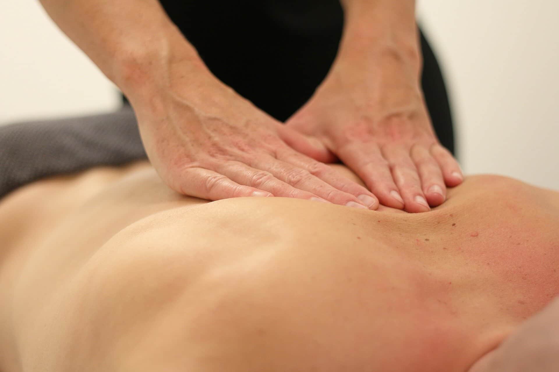 man giving lymphatic draining massage in Sutton clinic